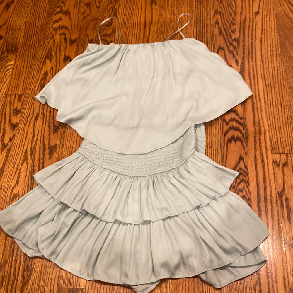 Green romper. Worn once. Preppy style. Flowy. Cut out in the back. Size small.